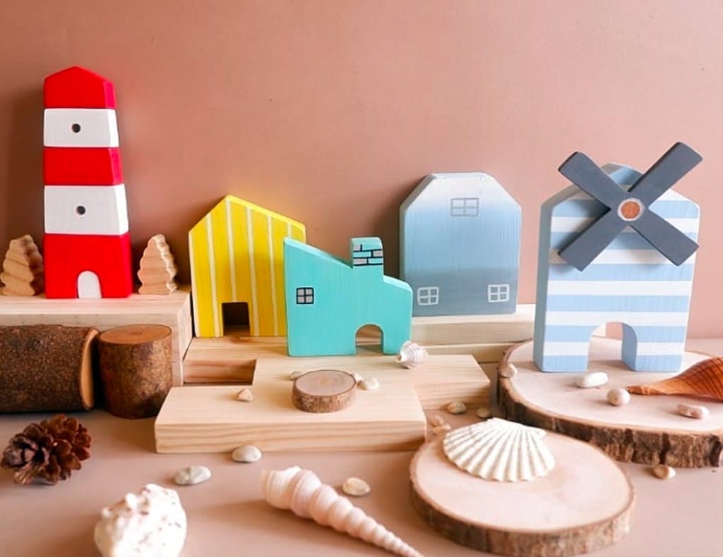 Wooden toy of a village and windmill